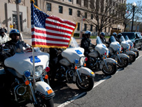 Line of MPDC motorcycles and American flag